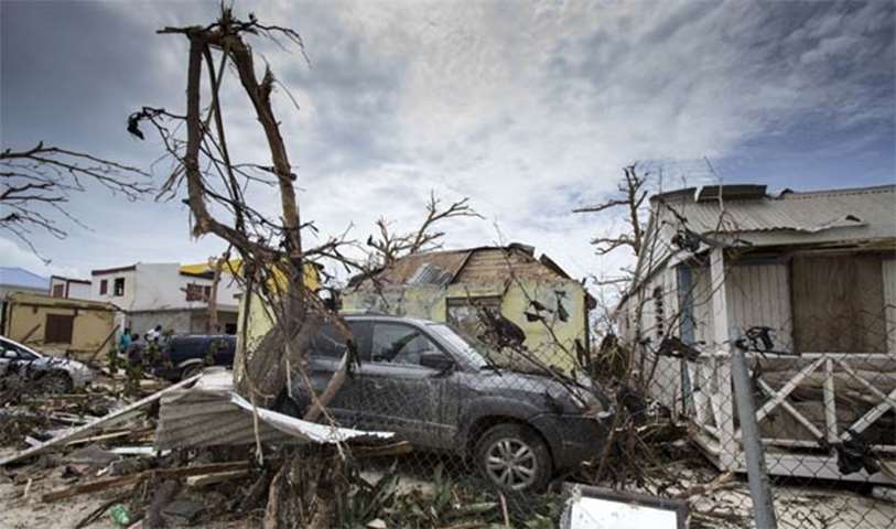 Houses and cars are damaged after the passage of hurricane on the Caribbean island of Saint Martin