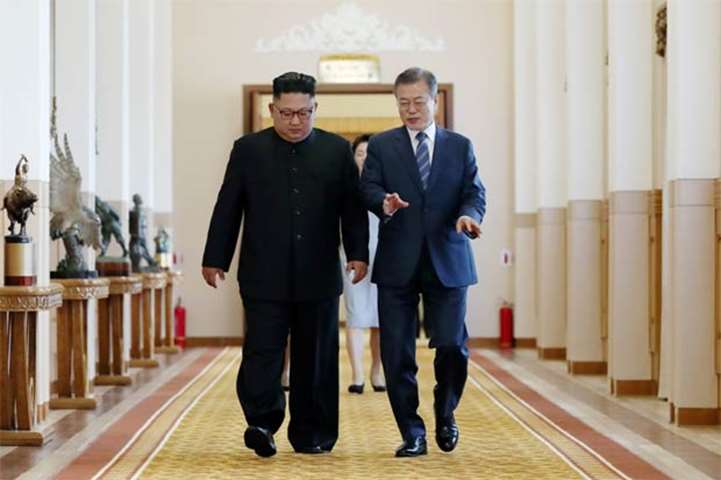 President Moon Jae-in and Kim Jong Un arrive for their meeting in Pyongyang on Wednesday
