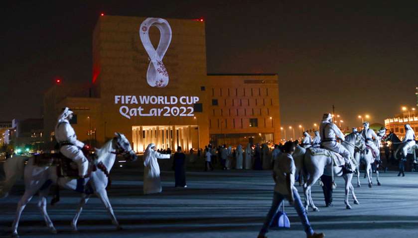Qataris gather at the capital Doha\'s traditional Souq Waqif market as the official logo of the FIFA 
