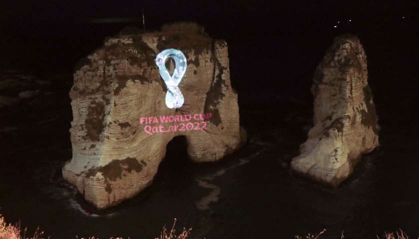 The Fifa World Cup Qatar 2022 logo is projected on the famous Pigon\'s Rock landmark in the Lebanese 