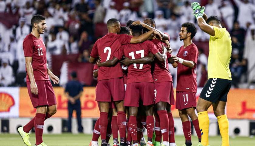Qatar\'s players celebrate after scoring a goal against Afghanistan during the second round Group E q