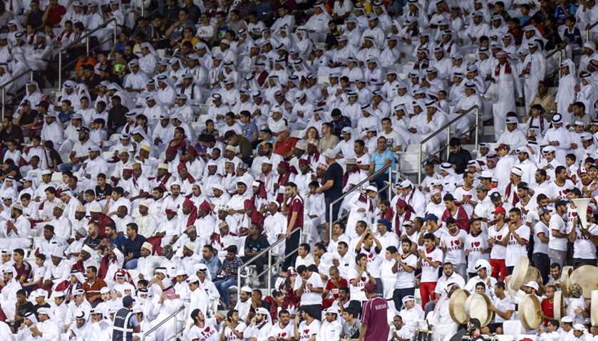 Qatar football fans cheer for their team during the second round Group E qualification football matc