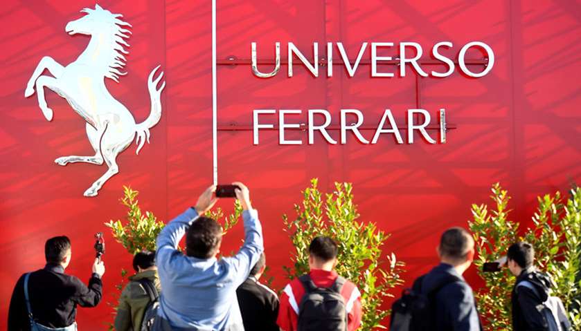 A visitor takes photos during the \'Universo Ferrari\' exhibition, in Maranello