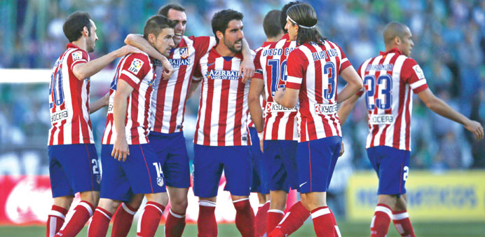 Atletico Madridu2019s Gabriel Fernendez is congratulated by teammates after scoring against Real Betis during their Spanish First Division match at Benito
