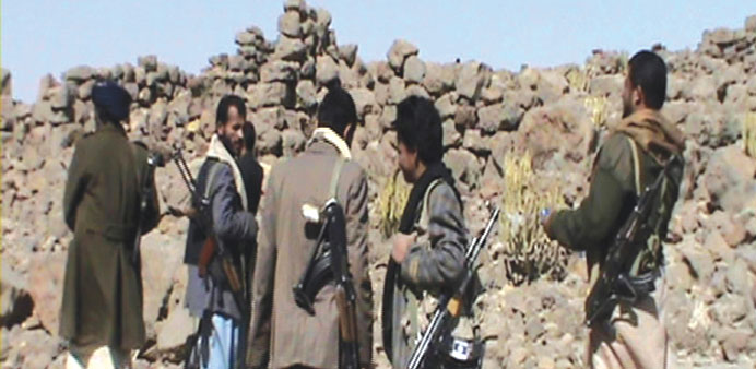 A picture taken by a mobile phone shows fighters of the Ahmar tribe somewhere in Omran province in northern Yemen yesterday.