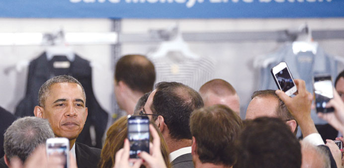 Obama greets the crowd after talking to local dignitaries and Walmart sales associates on energy efficiency at a Walmart Store in Mountain View, Calif
