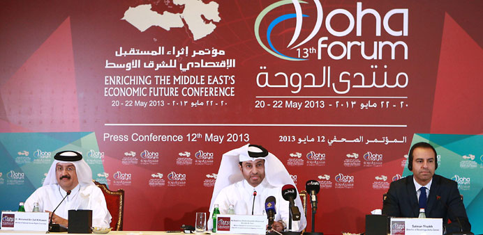 Dr Mohamed bin Saif al-Kuwari (left),  Sheikh Ahmed bin Mohammed bin Jabr al-Thani (centre) and Salman Shaikh give details about the Doha Forum during