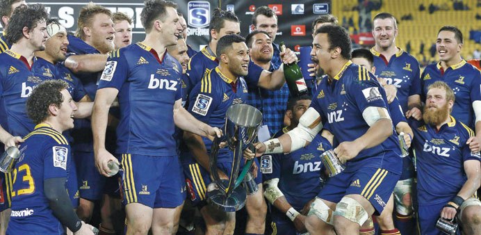 Otago Highlanders players celebrate winning the Super 15 rugby union final against Wellington Hurricanes at Westpac Stadium in Wellington yesterday.