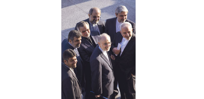  Iranian Foreign Minister Mohamed Javad Zarif and Iranian Atomic Energy Organisation chief Ali Akbar Salehi stand with other members of their delegati