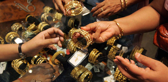 Customers examining gold jewellery in a shop in New Delhi.