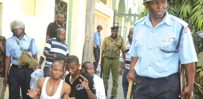 Muslim youths are arrested by police outside Masjid Mussa mosque in Majengo, Mombasa.