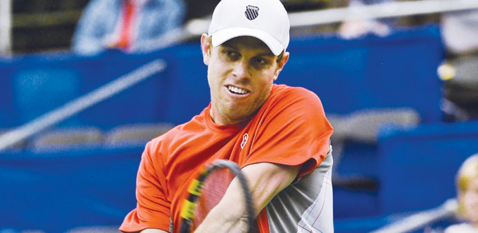 Sam Querrey hits a return to Alejandro Falla during their first round US Indoor Championship match  in Memphis on Tuesday. (EPA)