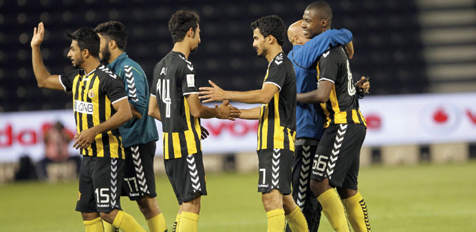Qatar Sports Club players celebrate their win over Al Sadd yesterday.