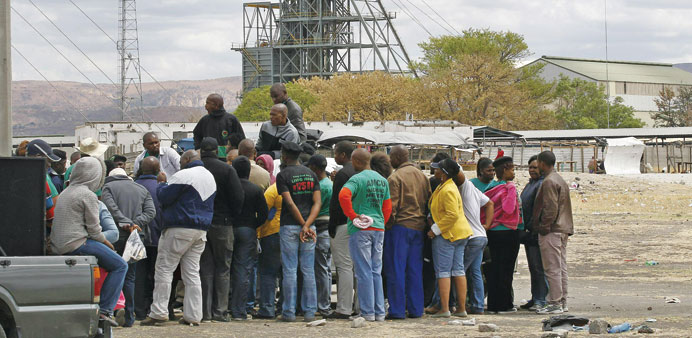 Miners gather near Anglo American Platinumu2019s Thembelani mine near the mining town of Rustenburg.