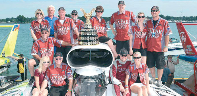 The triumphant 95 Spirit of Qatar team celebrate  pose with the trophy in Detroit on Sunday. PICTURE: Bill Osborne
