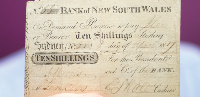 Colin Pitchfork, a consultant at Noble Numismatics, holding the only known specimen of the first official banknote issued in Australia in 1817.