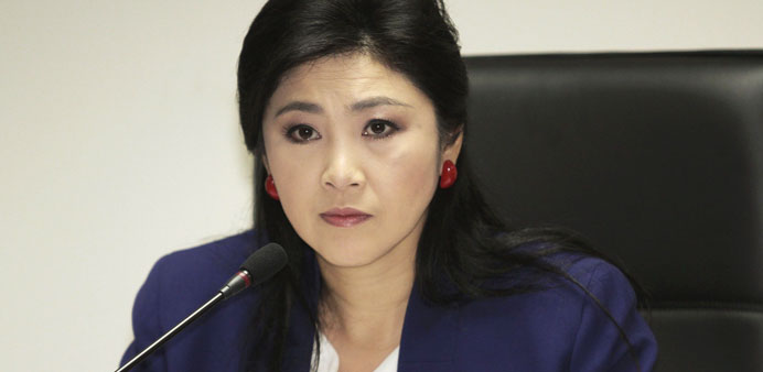 Prime Minister Yingluck Shinawatra attends her cabinet economic meeting at the office of the Permanent Secretary of Defence in Bangkok yesterday.