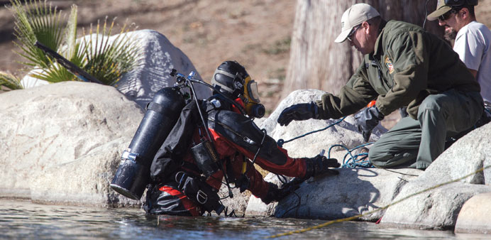 Dive teams from the San Bernardino County Sheriffu2019s Department to search Seccombe Lake Park for evidence tied to the San Bernardino shooting rampage o