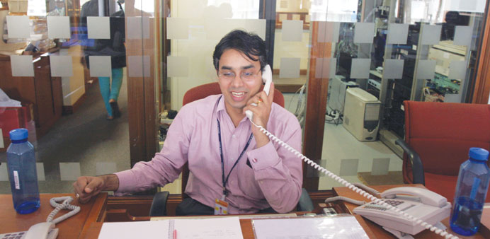 A stock broker speaks on a telephone at a security firm in Mumbai (file). The Sensex yesterday increased 0.6% to 21,193.58, the highest close since De