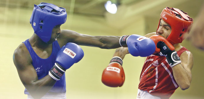 Boxers from the young adults category in action at the Doha Open Boxing Championship at Qatar Sports Club yesterday.