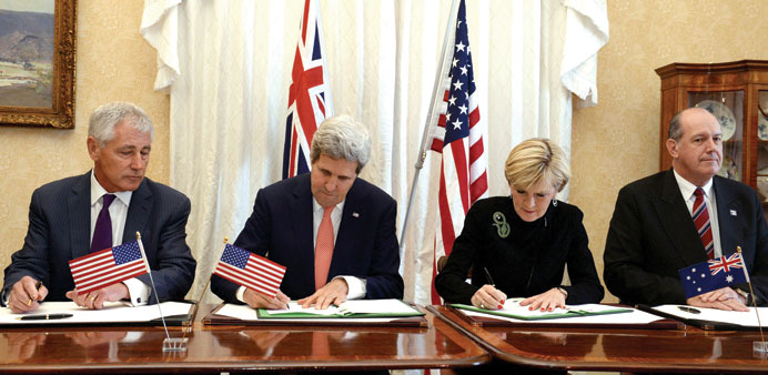 Australian Foreign Minister Julie Bishop and US Secretary of State John Kerry sign a Force Posture Agreement at Admiralty House in Sydney as Australia