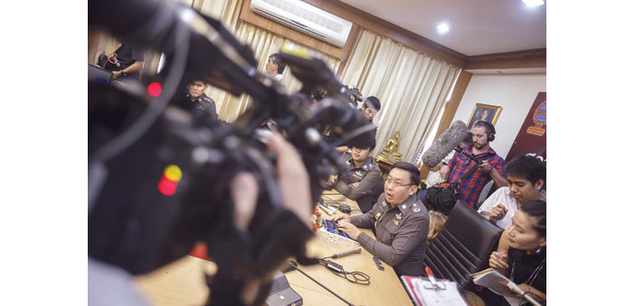    Police Colonel Padermchit speaks during a news conference at Ladprao Police Station in Bangkok yesterday.