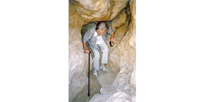 STRONG FOOTPRINT: Beatrice de Cardi in her 90s, exploring a cavern.