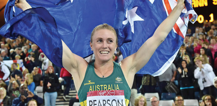 Australiau2019s Sally Pearson celebrates after winning gold in the womenu2019s 100m hurdles athletics in Glasgow. (AFP)