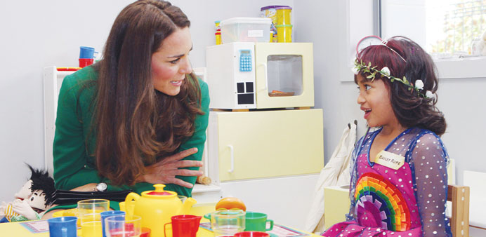 Catherine, the Duchess of Cambridge, talks with Bailey Taylor in the play room while visiting the Waikato Hospice Rainbow Place in Hamilton yesterday.