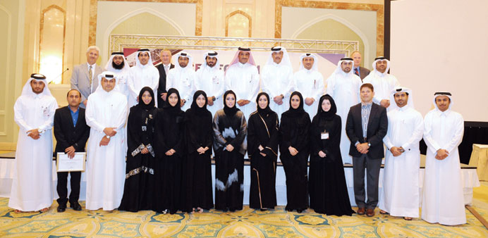 The Qatargas CEO with the national graduates and officials at the forum.