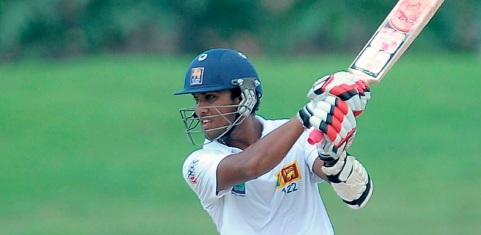 Sri Lankau2019s Dinesh Chandimal plays a shot  during the second day of their opening Test match against Bangladesh