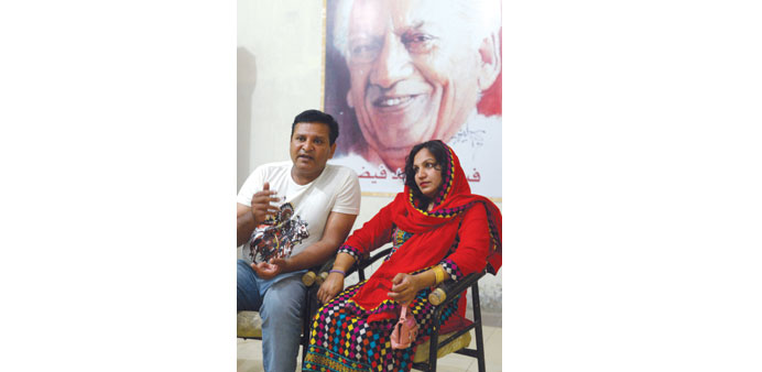Pakistani video journalist Naadir Maan and his wife Saba speak during an interview with AFP in Faisalabad.