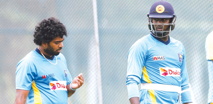Sri Lankan captain Angelo Mathews (right) talks to teammate Lasith Malinga during a practice session ahead of their first ODI against Pakistan in Hamb