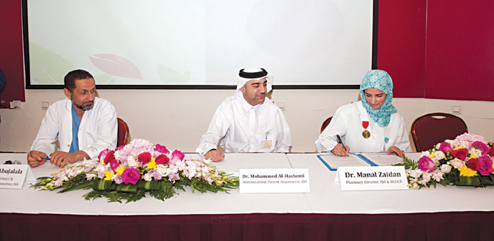 From right: Dr Manal Zaidan, Dr Mohamed al-Hashemi and Dr Salem Abu Jalala signing a collaborative agreement.