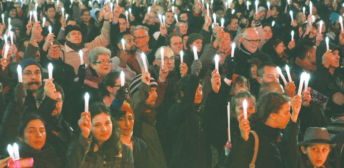 Delegates and supporters from the Aids 2014 conference hold a candlelight vigil in Federation Square in Melbourne to remember their colleagues who wer