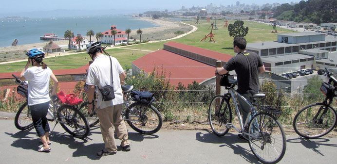  Cyclists take in a view from the Presidio Parkway in San Francisco, California. 