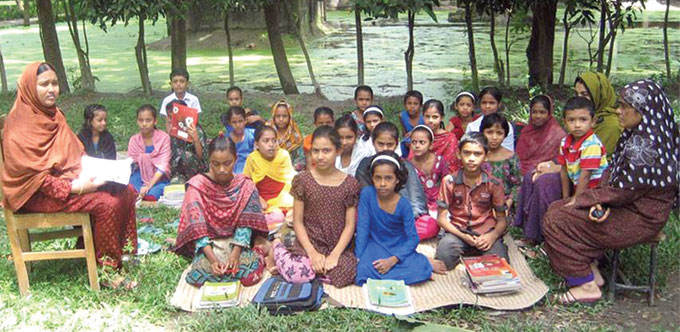 Students attend open-air classes after their school was flooded in Matlab sub-district of Chandpur.