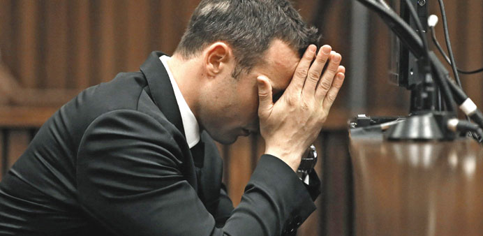 Oscar Pistorius sits in the dock ahead of a hearing in his trial at the North Gauteng High Court in Pretoria.