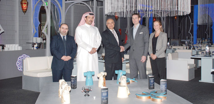 Doha Bank and Renaissance Doha City Center Hotel officials.