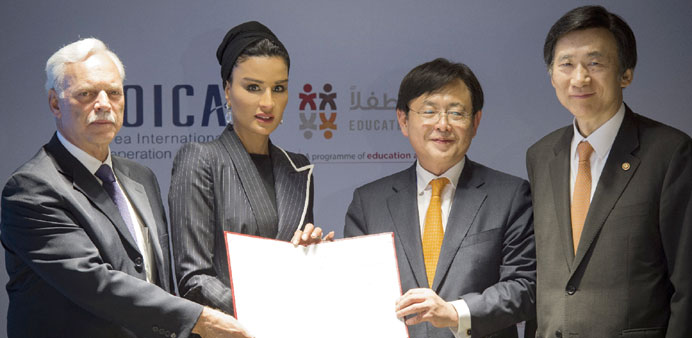 HH Sheikha Moza bint Nasser, Yun Byung-se (right), Young-mok Kim and Marcio Barbosa at the agreement signing ceremony yesterday. PICTURE: Aisha al-Mus