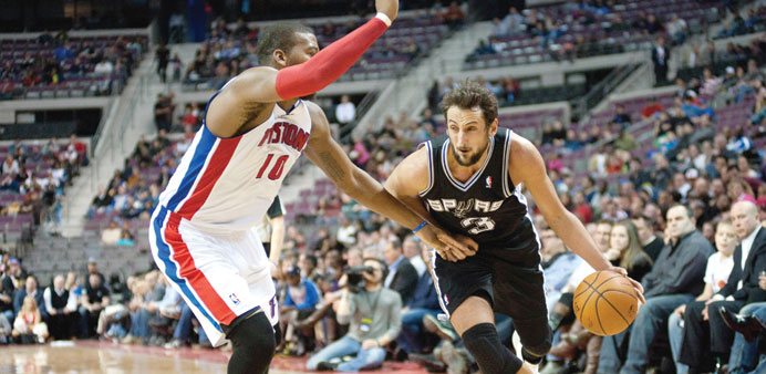 San Antonio Spurs point guard Cory Joseph (right) goes to the basket against Detroit Pistons power forward Greg Monroe during the fourth quarter at Th
