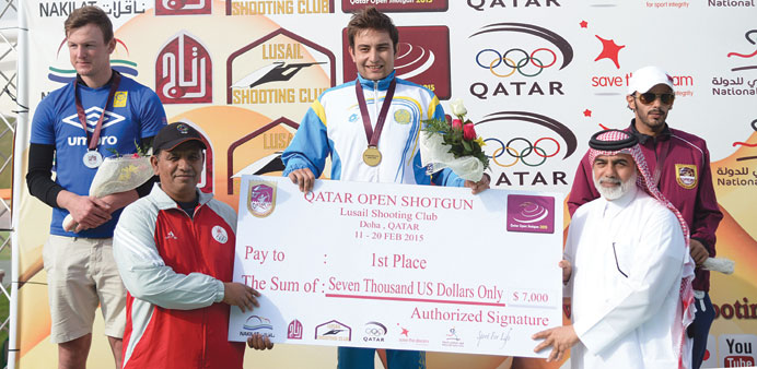 Winners of the senior menu2019s skeet event of Qatar Open Shotgun Championship celebrate at the podium yesterday.