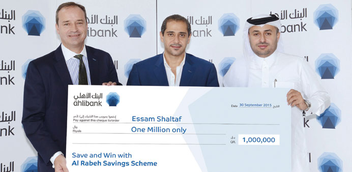 Essam Shaltaf, who has been with Ahlibank since 2013, receives the QR1mn prize from Ahlibank officials.