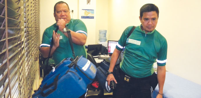 Roel Dionisio and Ferdie Aldea, ambulance paramedics of Hamad hospital, believe 2013 will be a good year for expatriate workers in Qatar.  PICTURE: Jo