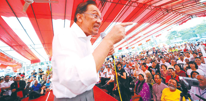 Malaysiau2019s opposition leader Anwar Ibrahim speaks as he campaigns for his party 