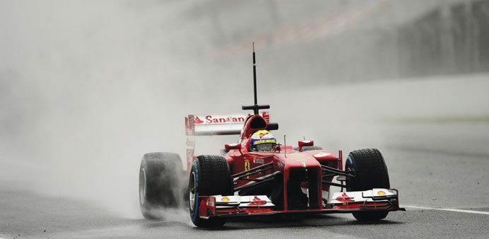 Ferrariu2019s Brazilian driver Felipe Massa drives during the fourth day of Formula One testing at Circuit de Catalunya near Barcelona last week; (below) 
