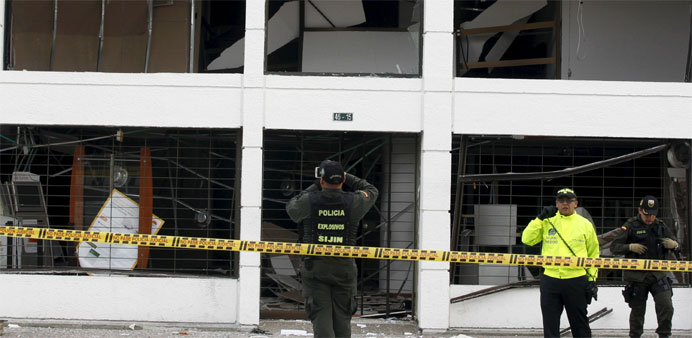 Policemen work the scene where an explosion occurred in downtown Bogota