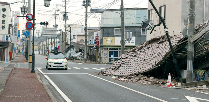 This handout photograph released yesterday by Google Street View of a car mounted with a street view camera as it drives through a street in Namie tow