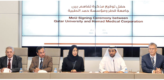   QU and HMC officials at the signing ceremony.