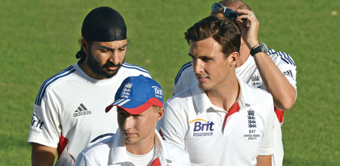 Englandu2019s cricketers Steven Finn (right), Joe Root (centre) and Monty Panesar leave the ground at the end of the tour match against Australia Chairman
